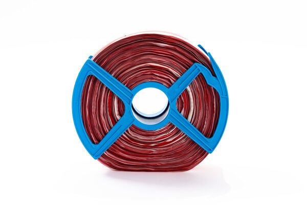 Extrem reißfestes Nylon-Absperrband in rot-weiß auf Rolle mit blauem Kunststoffabroller